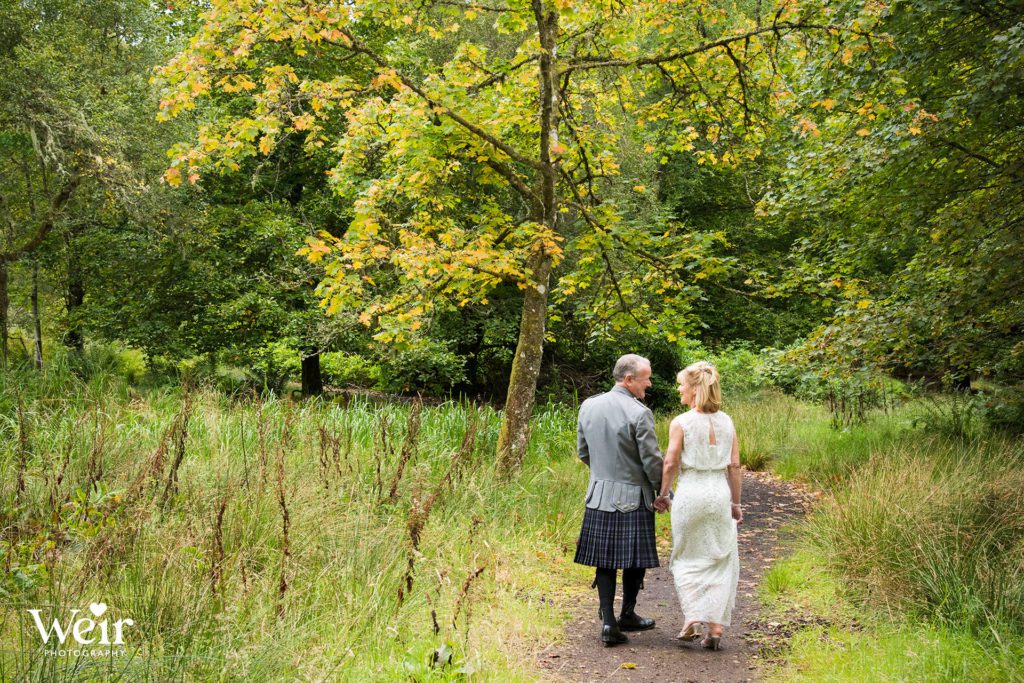 Bride & Groom walking to Loch near Cromlix House