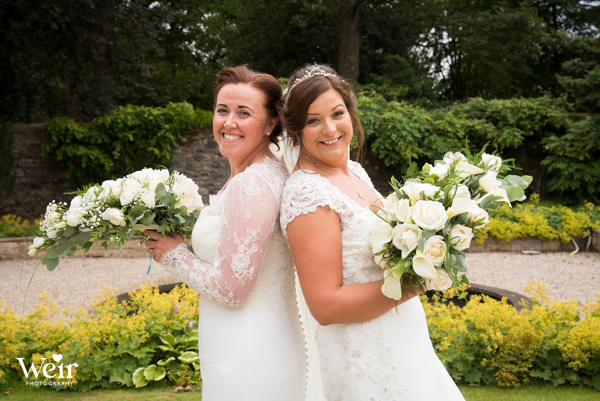 Brides in Carlowrie Castle gardens