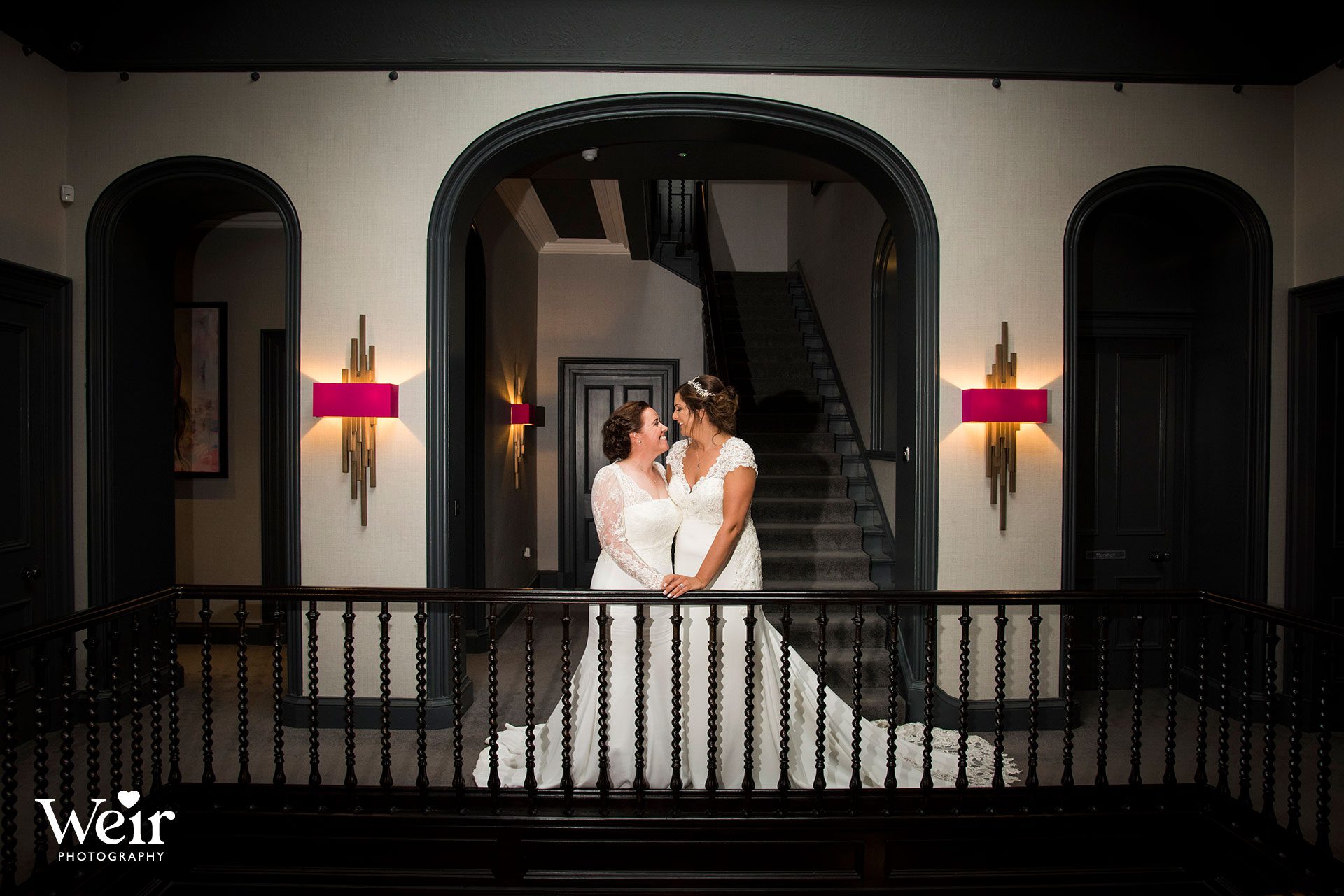 Brides at staircase in Carlowrie Castle